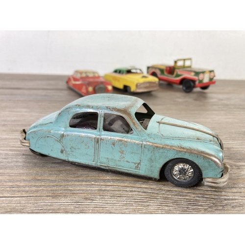 409 - Five mid 20th century tinplate model vehicles