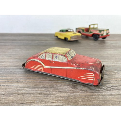 409 - Five mid 20th century tinplate model vehicles