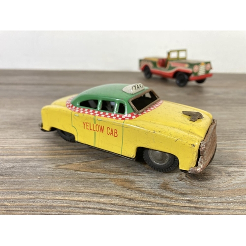 409 - Five mid 20th century tinplate model vehicles