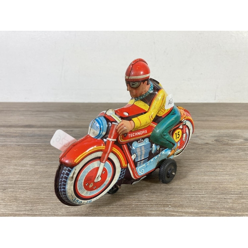 411 - A mid 20th century Technofix 350-19 tinplate model motorcycle - approx. 12cm high x 18cm long