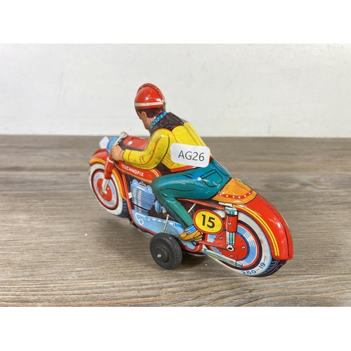 411 - A mid 20th century Technofix 350-19 tinplate model motorcycle - approx. 12cm high x 18cm long