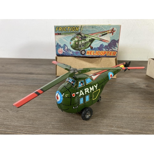 411B - Two boxed model vehicles, one Marx H-1993 tinplate friction helicopter and one training plane