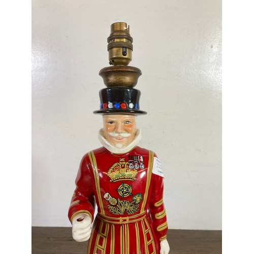 322A - A Carlton Ware Ltd hand painted ceramic Beefeater table lamp - approx. 48cm high