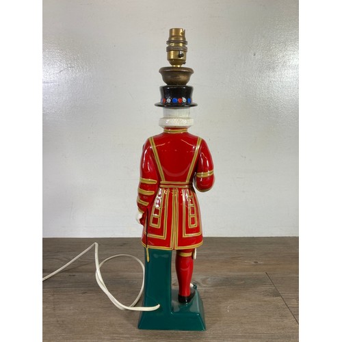 322A - A Carlton Ware Ltd hand painted ceramic Beefeater table lamp - approx. 48cm high