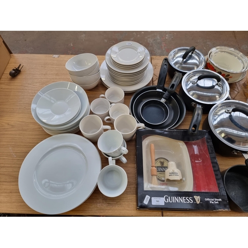 765 - A large collection of kitchenware and crockery to include boxed Prima stainless steel teapot, boxed ... 