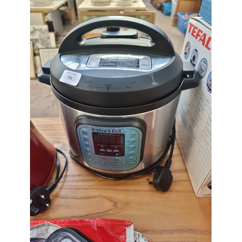 773 - Two items, one Instant Pot Duo 60 electric pressure cooker and one Russell Hobbs food processor with... 