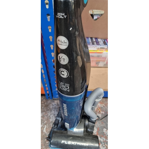 786 - A Hoover Flexi Power cordless bagless vacuum cleaner with charging station and attachments