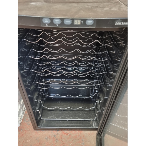 793 - A Samsung RW13EBSS six shelf wine chiller