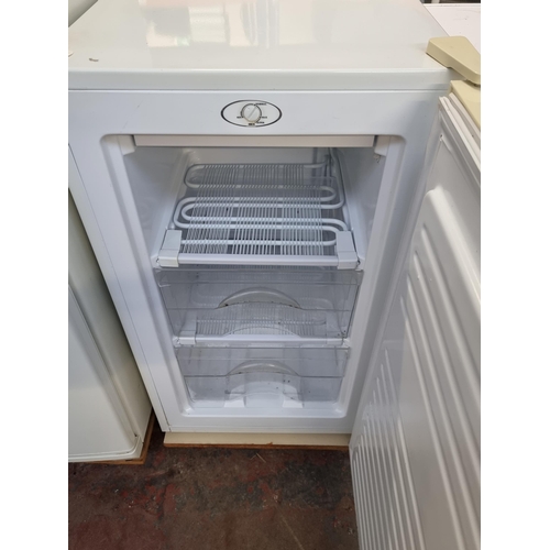 799 - An Argos AAFZ4884W under counter freezer with fitted trolley - approx. 48cm wide