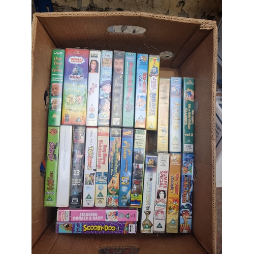 739 - Six boxes containing a large collection of VHS videos - see images for titles