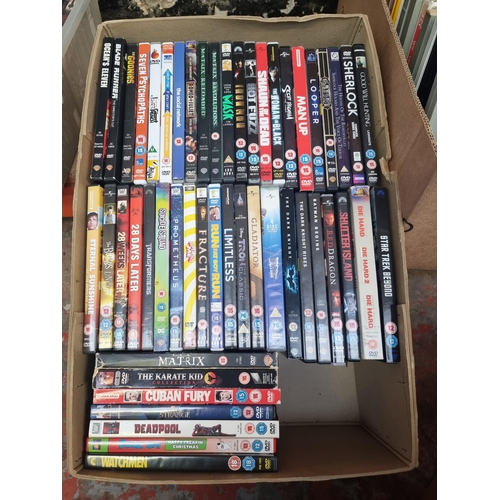 741 - Two boxes containing a collection of DVDs and DVD box sets - see images for titles