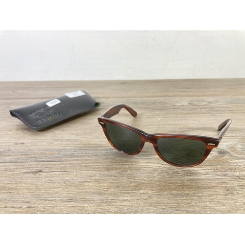 434 - A cased pair of Bausch & Lomb Ray-Ban Wayfarer tortoiseshell effect sunglasses