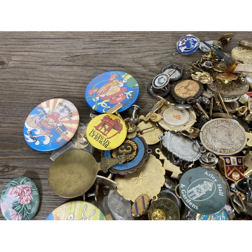 439 - A large collection of vintage pin badges