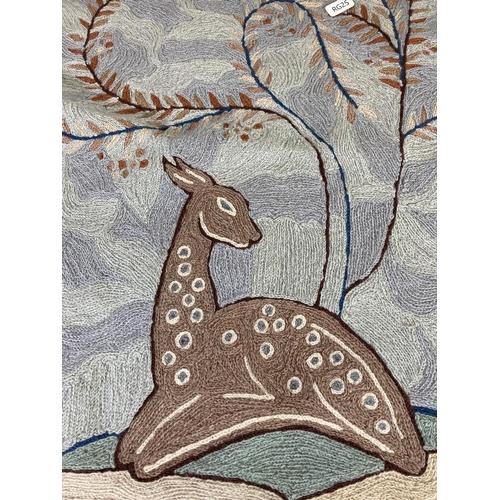 445 - An embroidered wall hanging with deer design - approx. 65cm high x 47cm wide