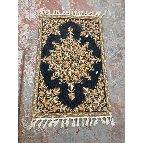 449 - An embroidered floral patterned wall hanging - approx. 107cm long x 61cm wide