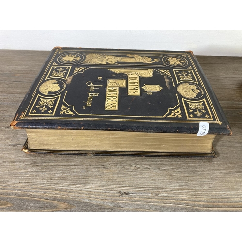 461 - Two late 19th/early 20th century hardback leather bound books, The Holy Bible and The Pilgrims Progr... 