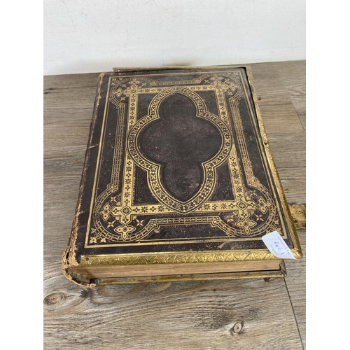 461 - Two late 19th/early 20th century hardback leather bound books, The Holy Bible and The Pilgrims Progr... 