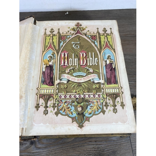 461 - Two late 19th/early 20th century hardback leather bound books, The Holy Bible and The Pilgrims Progr... 