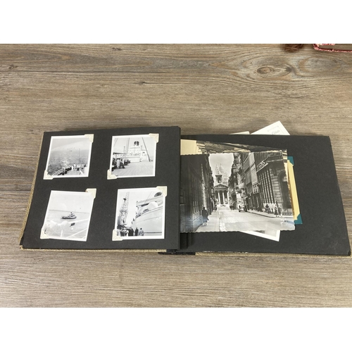 472 - A collection of early and mid 20th century photographs and postcards