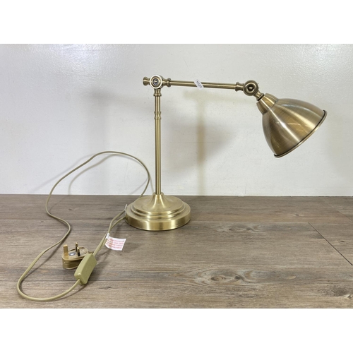 474 - An industrial style brass effect table lamp