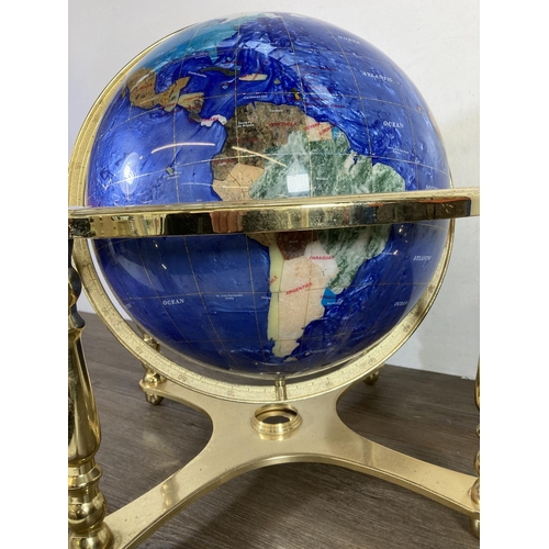 480 - A polished semi precious stone and brass terrestrial globe - approx. 45cm high