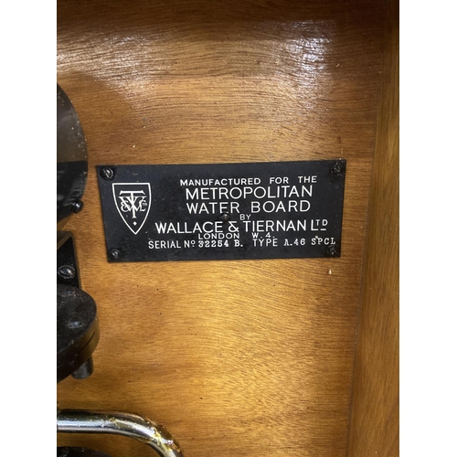 492 - An early/mid 20th century Wallis and Tiernan Ltd for the Metropolitan water board type oak cased A.4... 