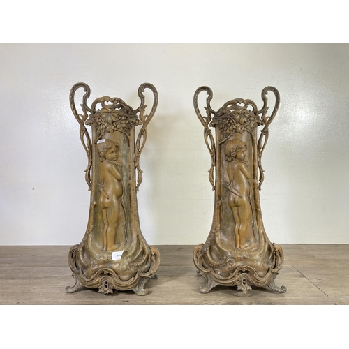 510 - A pair of Art Nouveau Fabrication Francaise of Paris patinated spelter two handled vases after Arist... 