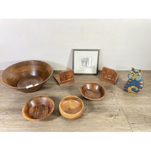 511 - Eight items to include large circular teak bowl - approx. 15cm high x 35cm diameter, pair of carved ... 