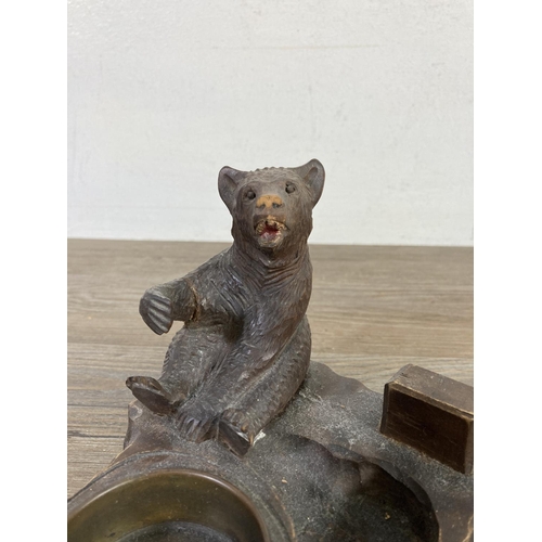 512 - An antique Black Forest carved bear pipe rack and ash tray - approx. 14cm high x 14cm wide