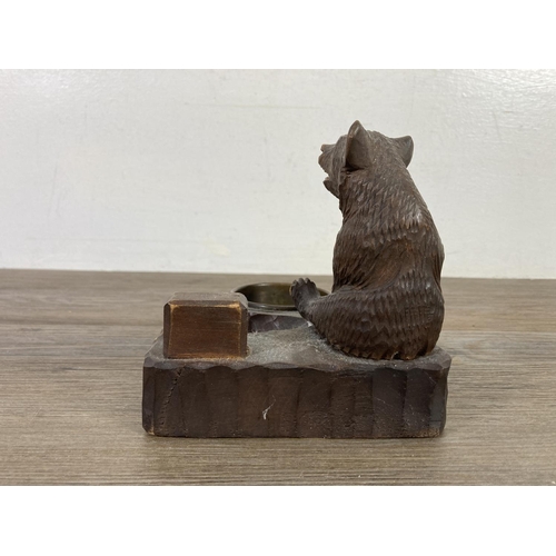 512 - An antique Black Forest carved bear pipe rack and ash tray - approx. 14cm high x 14cm wide