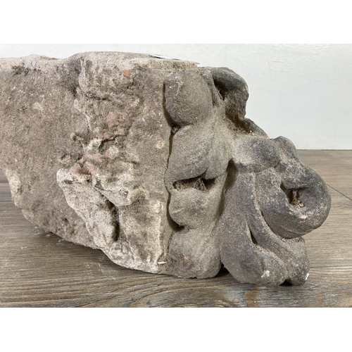 516 - A medieval carved stone corbel - approx. 32cm x 18cm x 17cm