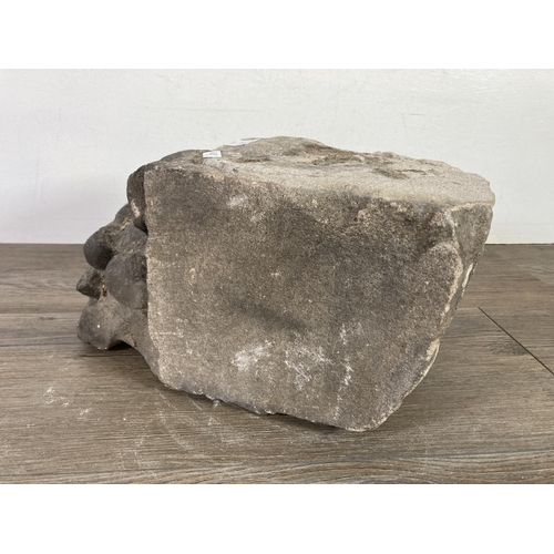 516 - A medieval carved stone corbel - approx. 32cm x 18cm x 17cm