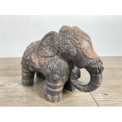 522 - Two Indian handmade clay elephant figurines - approx. 15cm high x 7cm wide