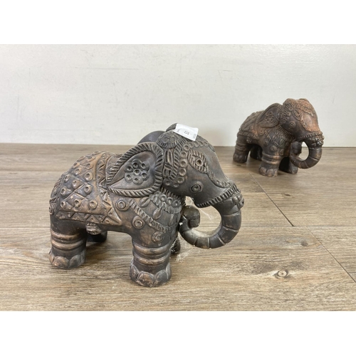 522 - Two Indian handmade clay elephant figurines - approx. 15cm high x 7cm wide