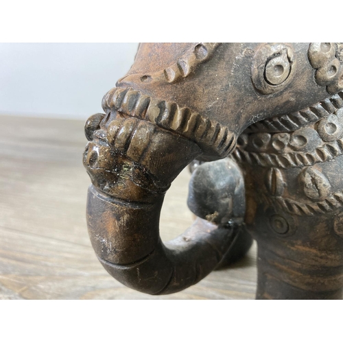 522 - Two Indian handmade clay elephant figurines - approx. 15cm high x 7cm wide