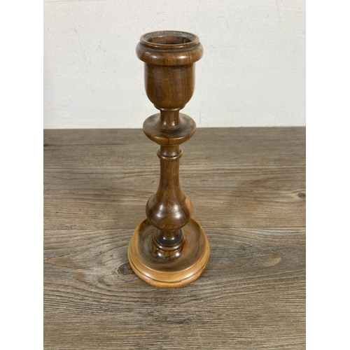 525 - Three early 20th century Jerusalem olive wood items, 20cm candlestick, pressed flowers book and puzz... 