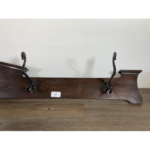 526 - An Edwardian mahogany wall mountable coat hanger with four hooks - approx. 125cm wide x 16cm high