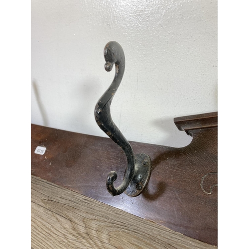 526 - An Edwardian mahogany wall mountable coat hanger with four hooks - approx. 125cm wide x 16cm high