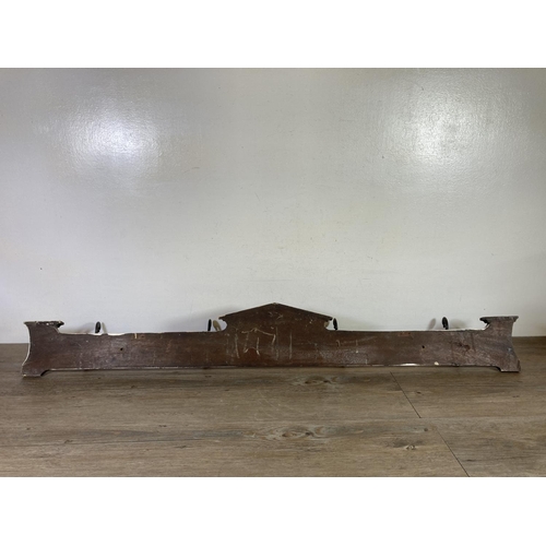 526 - An Edwardian mahogany wall mountable coat hanger with four hooks - approx. 125cm wide x 16cm high