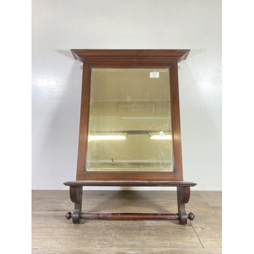 527 - An Edwardian mahogany framed bevelled edge wall hanging mirror - approx. 69cm high x 50cm wide