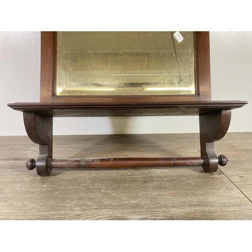 527 - An Edwardian mahogany framed bevelled edge wall hanging mirror - approx. 69cm high x 50cm wide