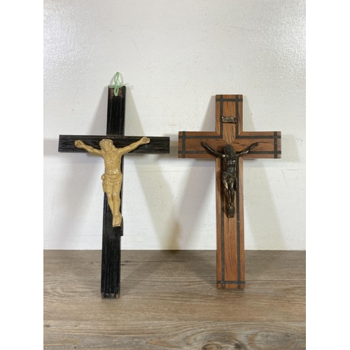 530 - Two early 20th century wooden crucifixes - largest approx.  38cm high x 20cm wide