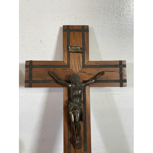 530 - Two early 20th century wooden crucifixes - largest approx.  38cm high x 20cm wide