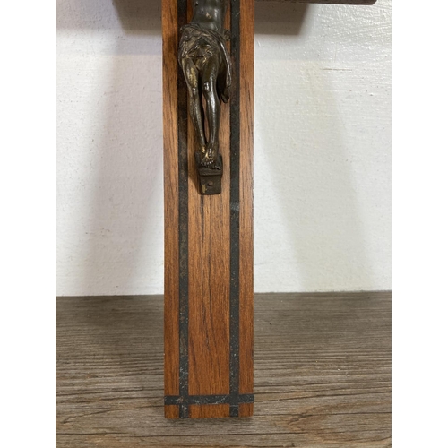 530 - Two early 20th century wooden crucifixes - largest approx.  38cm high x 20cm wide