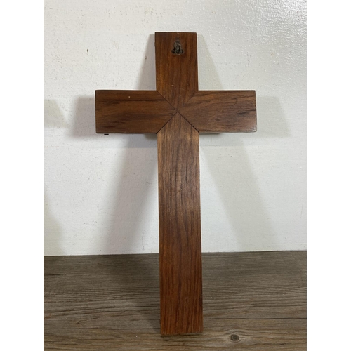 530 - Two early 20th century wooden crucifixes - largest approx.  38cm high x 20cm wide