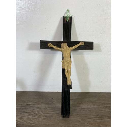 530 - Two early 20th century wooden crucifixes - largest approx.  38cm high x 20cm wide