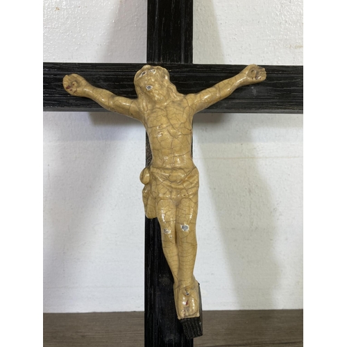 530 - Two early 20th century wooden crucifixes - largest approx.  38cm high x 20cm wide