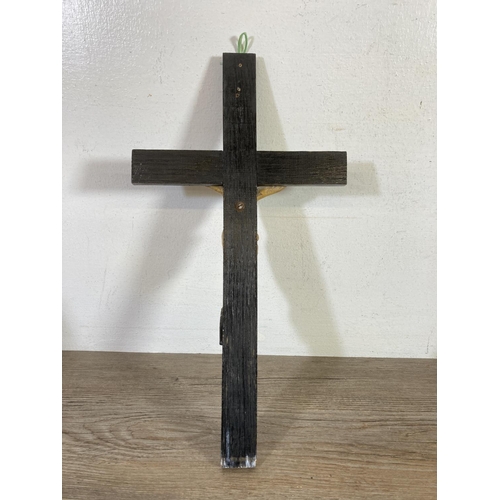 530 - Two early 20th century wooden crucifixes - largest approx.  38cm high x 20cm wide