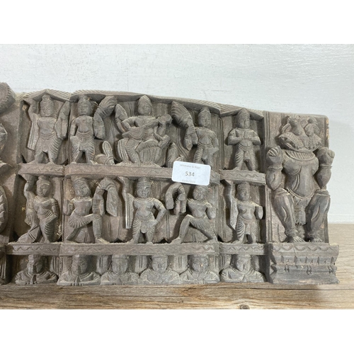 534 - A mid 20th century Indian carved hardwood wall plaque - approx. 85cm wide x 20cm deep