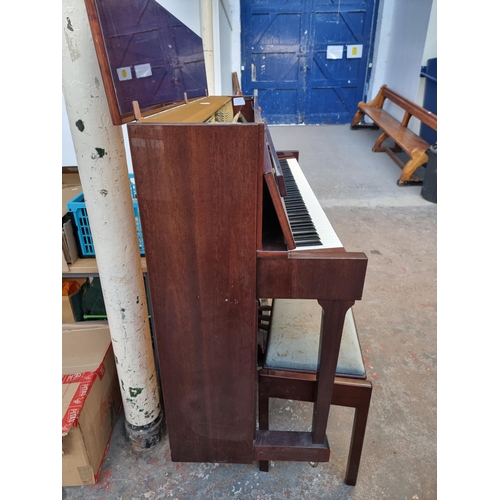 764 - A gloss mahogany Chappell eighty-eight key, three pedal upright piano with duet stool containing she... 